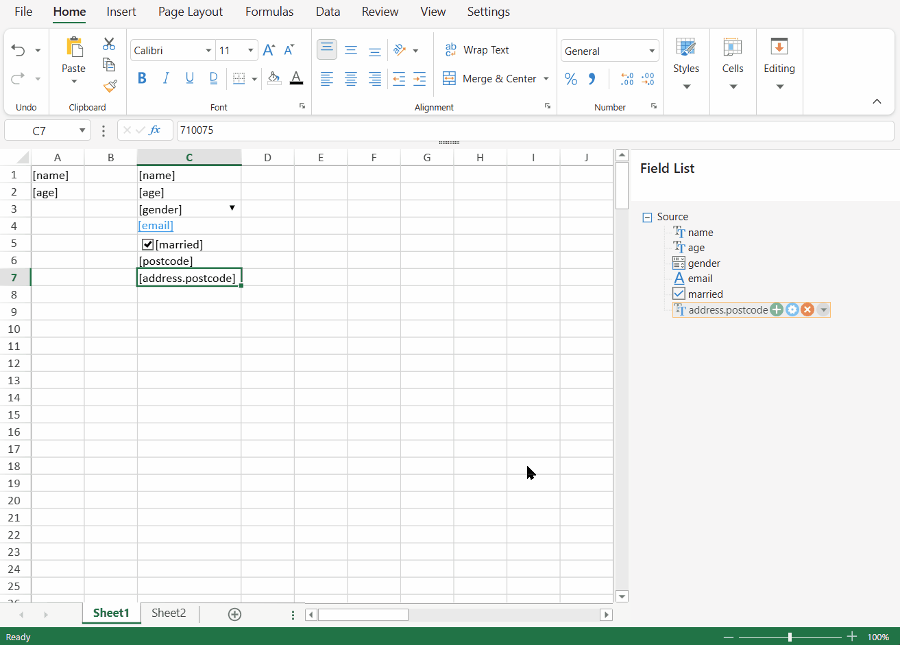 SpreadJS Designer automatically creates an editable label beside a bound cell when a field is dragged onto the worksheet.