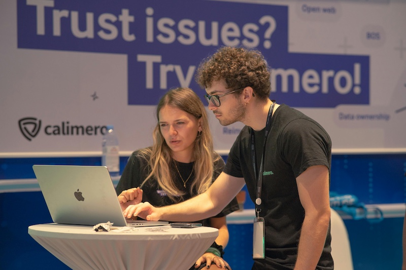 Software developers at a trade show booth